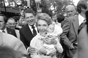 Ronald Reagan and wife Nancy Reagan say hello to Angelina Thompson, 4-month-old at the East Texas Fair in Tyler, Texas  Wednesday, Sept. 24, 1980. Gov. Reagan toured the fair briefly before speaking to a campaign rally on the fairgrounds. (AP Photo/CH)